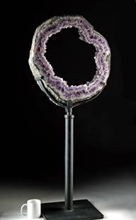 Spectacular Amethyst Geode Slice on Custom Stand (Brazil): South America, Brazil, ca. millions of years old. A spectacular display specimen showcasing a massive amethyst geode slice with rich violet crystal formations encircling a natural open center. The