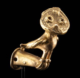 Colombian Sinu Gold Owl Finial (from Ceremonial Staff): Pre-Columbian, Colombia, Sinu Culture, ca. 800 to 1500 CE. A rare and refined Sinu gold finial depicting a perched owl, its broad, rounded head turned sharply to the side in lifelike alertness. Cast