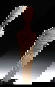 Early Cycladic Marble Idol Spedos Type, ex-Sotheby's: Ancient Greece, Early Cycladic II, Keros–Syros Culture, circa 2700–2300 BCE. Carved from fine-grained island marble, the figure with folded arms beneath the chest, an elongated neck, and a gently