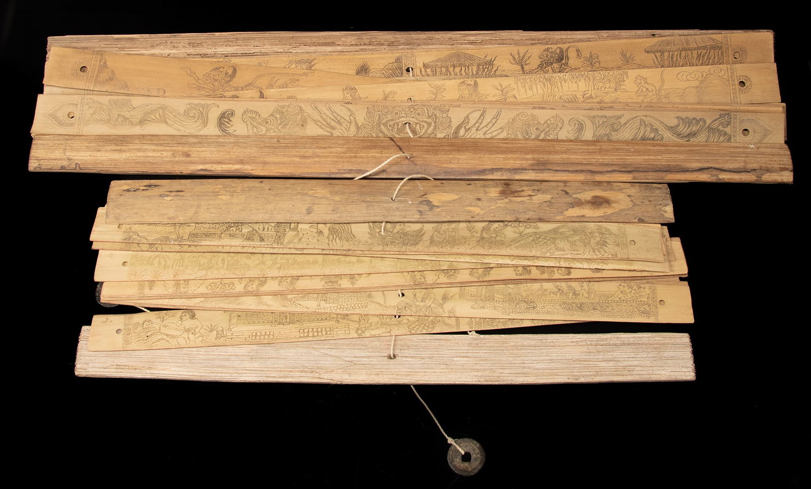 Two Balinese Palm Leaf Illustrated Lontar Manuscripts: **Originally Listed At $400** Southeast Asia, Indonesia, Bali, ca. mid-20th century CE. A pair of palm leaf manuscripts, known as lontar, bound together with cotton cords between two wooden slat cover