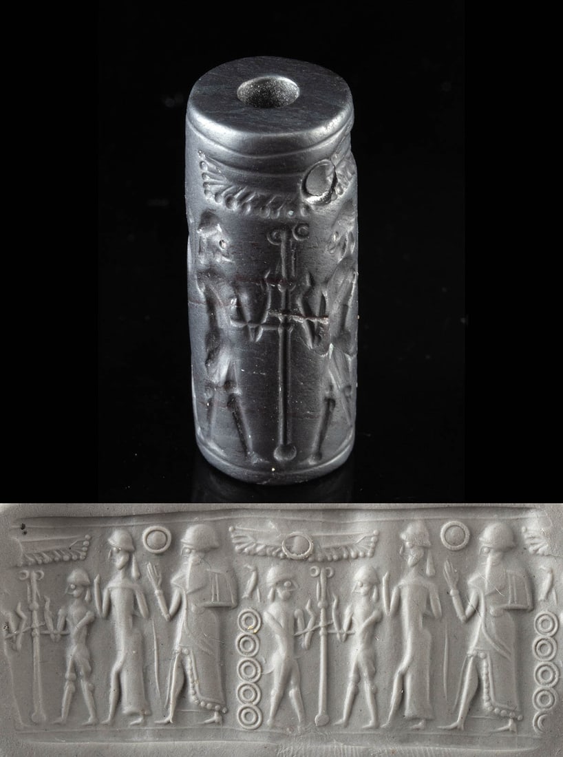Babylonian Hematite Cylinder Seal - Procession: Ancient Near East, Mesopotamia, Babylonian, ca. 19th to 16th century BCE. A compact universe of myth and ceremony spirals around this finely carved hematite cylinder seal, its dark surface holding a p