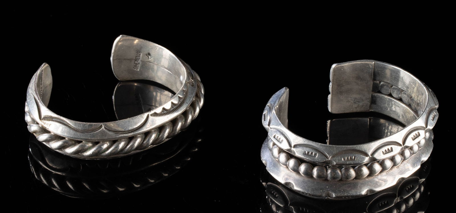 Two Navajo Silver Cuffs - One by Orville Tsinnie: Orville Z. Tsinnie (Native American, Navajo, 1943-2017) and Anonymous Native American (active XX century). A pair of mid to late 20th century Navajo sterling silver bracelets, each handcrafted in trad