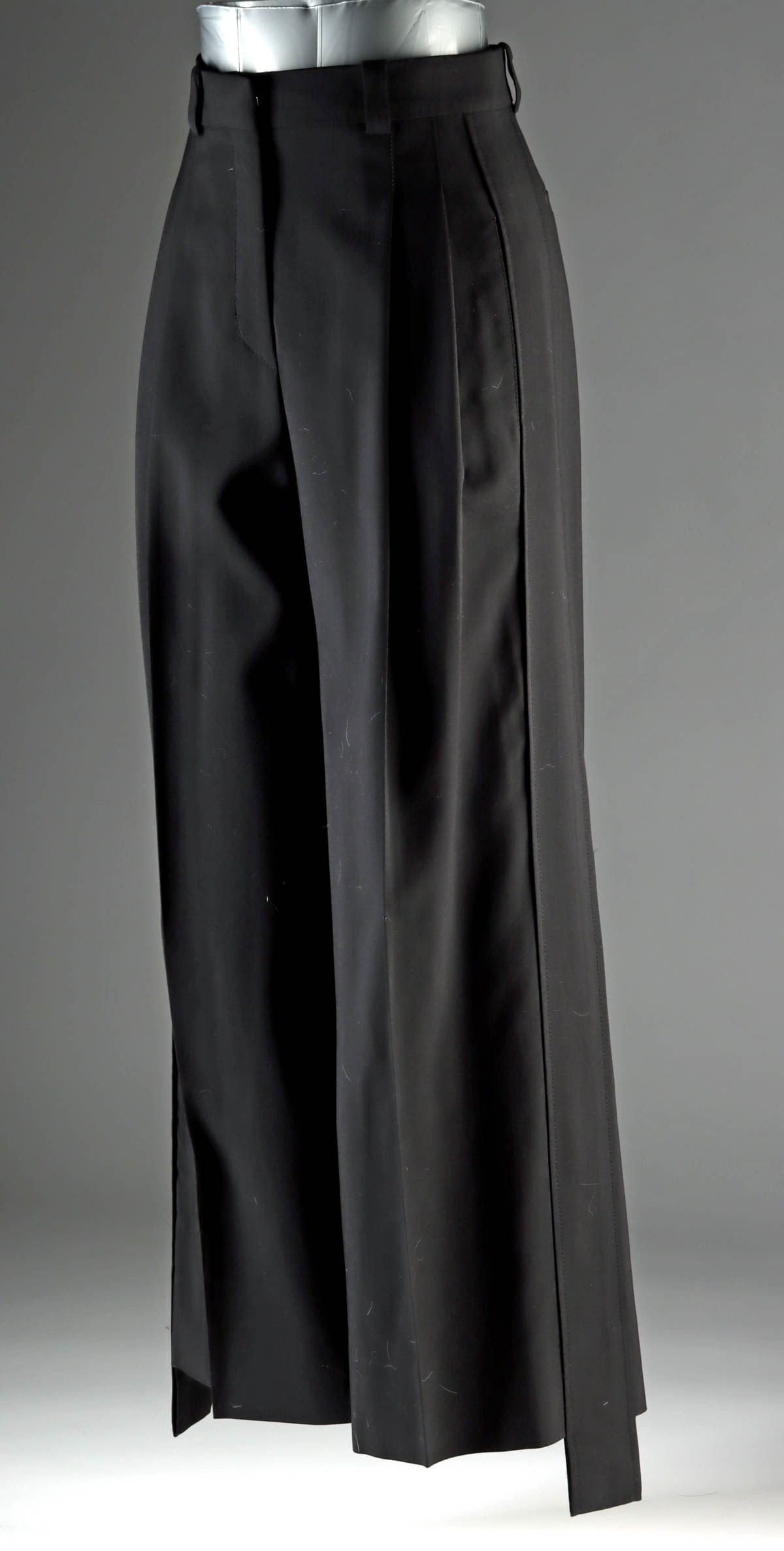 Louis Vuitton Black Japanese Wool Wide-Leg Trousers: France / Italy, ca. 21st century CE. Sculptural black tailored trousers by Louis Vuitton crafted from a luxurious Japanese black wool, prized for its dense matte finish, exceptional drape, and ability