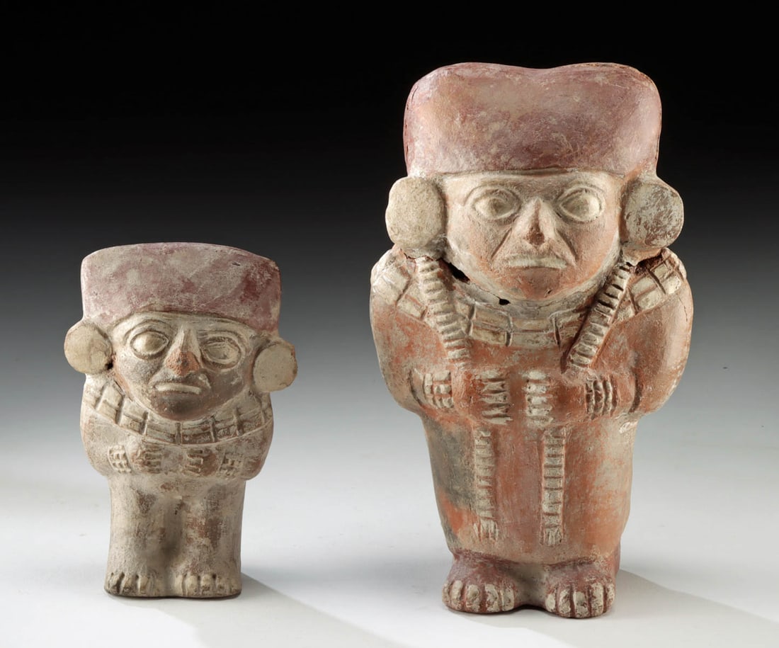 Pair of Moche Pottery Standing Figures, ex Museum: Pre-Columbian, Peru, Moche, ca. 100 to 800 CE. A pair of terracotta figural rattle sculptures, each designed with hollow bodies containing interior pellets that still produce a light sound when shaken