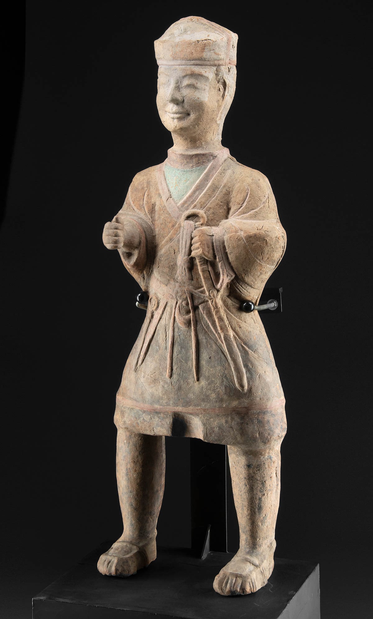 Rare / Large Han Chinese Laborer, Wu Region (TL Tested): East Asia, China, Wu region, late Han Dynasty to early Southern and Northern Dynasties, ca. 2nd to 5th century CE. A tall mold-made pottery laborer or farmer figure, one of the largest examples of a f
