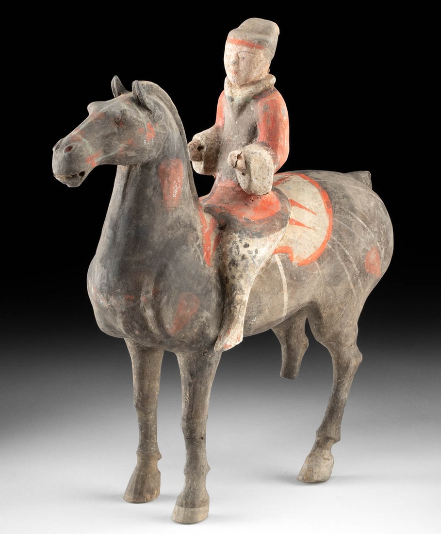 Han Dynasty Pottery Horse & Rider in Military Posture: East Asia, China, Han Dynasty, ca. 206 BCE to 220 CE. A pottery horse and rider like this carries the quiet pulse of the Han frontier, where cavalry units stitched the empire together and riders vanis