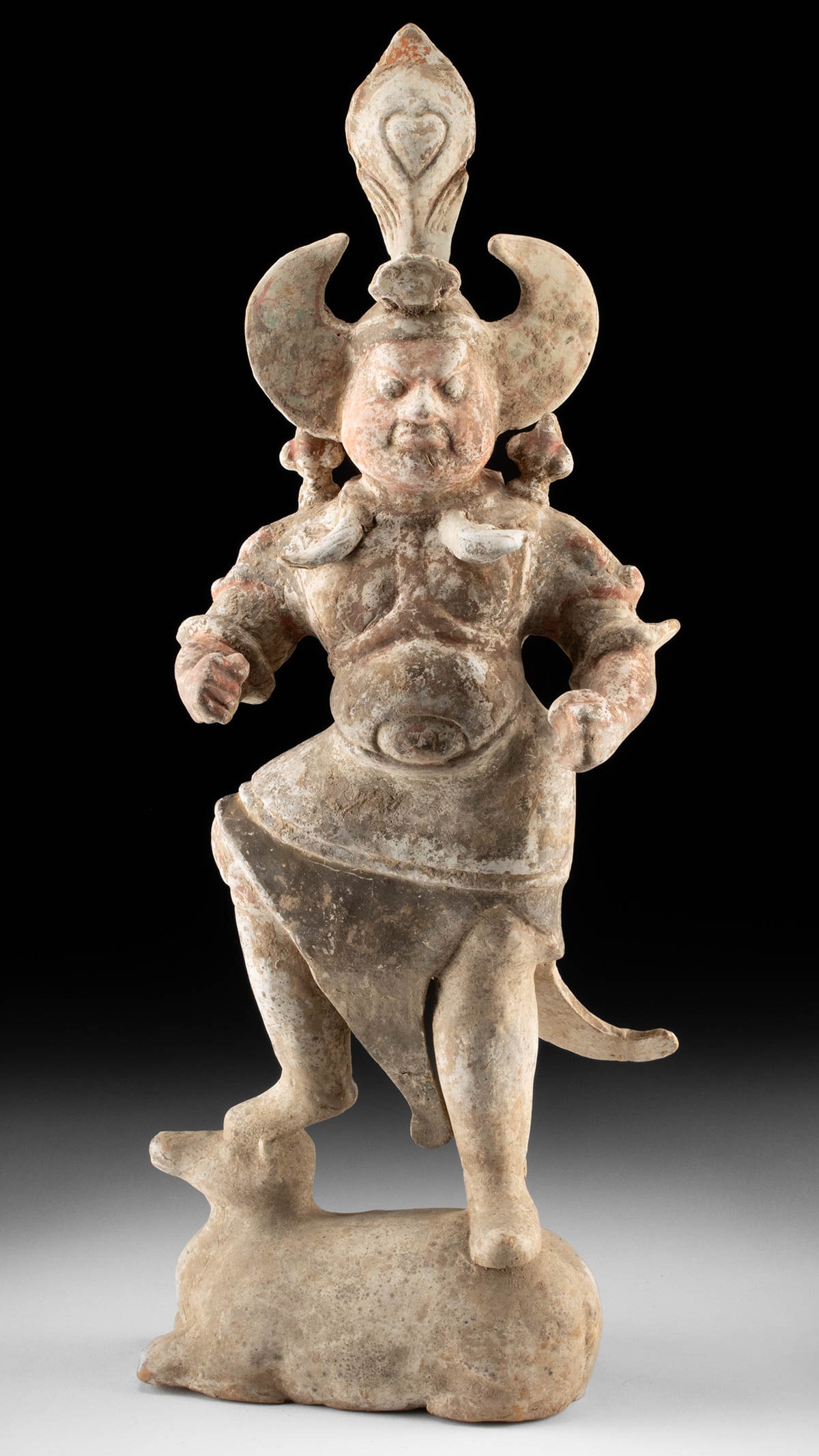 Chinese Tang Dynasty Pottery Lokapala Standing on Bull: East Asia, China, Tang dynasty, ca. 618 to 907 CE. A commanding presence fashioned in clay, this Tang dynasty pottery Lokapala strides forward with the poised certainty of a celestial sentinel. One fo
