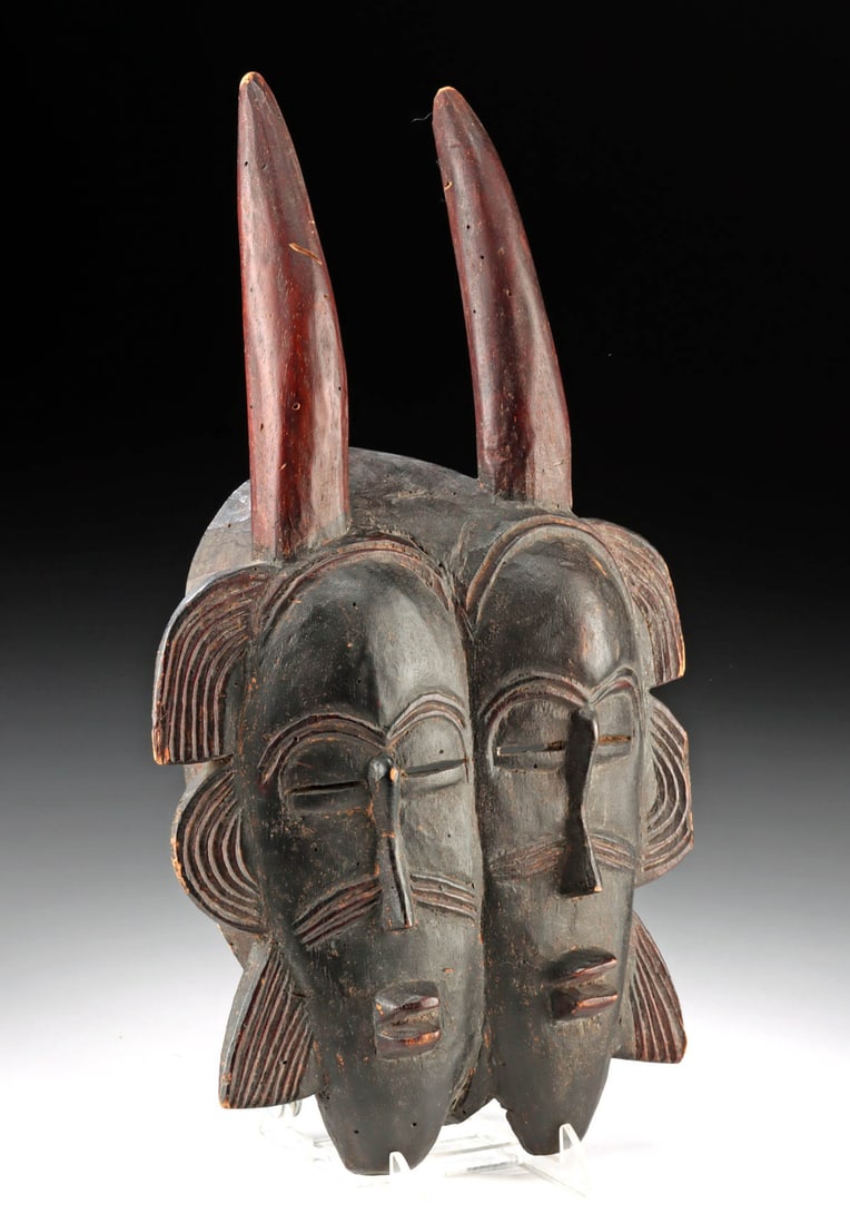 19th C. Senufo / Ligbi Double-Faced Kpelie Mask: West Africa, Ivory Coast, Senufo or Ligbi culture, ca. late 19th to early 20th century CE. This rare double-faced kpelie mask was created for use in ancestor (kpelie) rituals of the Poro (or Lo) secre