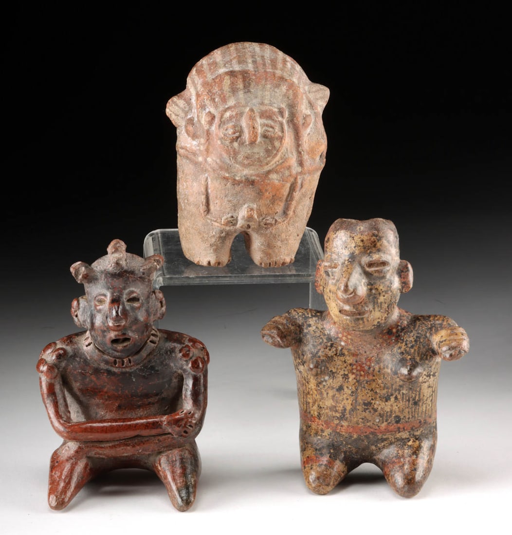 3 Chancay & West Mexican Effigy Pottery Figures: Pre-Columbian, West Mexico, Nayarit & Jalisco, ca. 300 BCE to 300 CE. A group of three ceramic figures. The hollow, rounded figure, is a nude male Chancay example with a rounded form and vertical stri