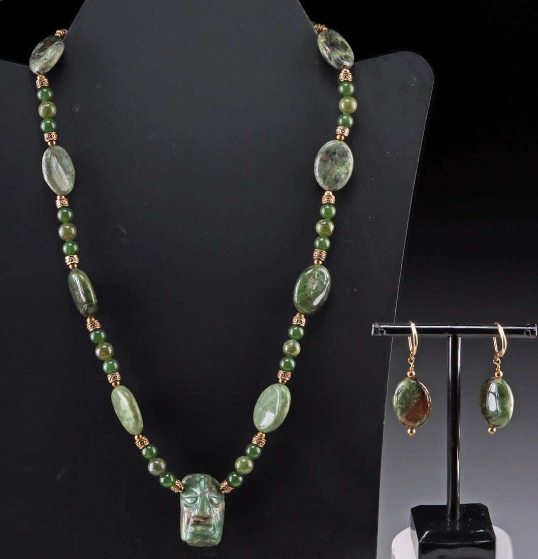 Maya Greenstone Necklace & Earrings Set w/ Carved Pendant Bead: Pre-Columbian (center pendant bead), Maya, ca. 500 to 900 CE. Wonderful carved hard greenstone bead of Maya origins, strung together with similar colored greenstone beads and discs. Beads are interspe