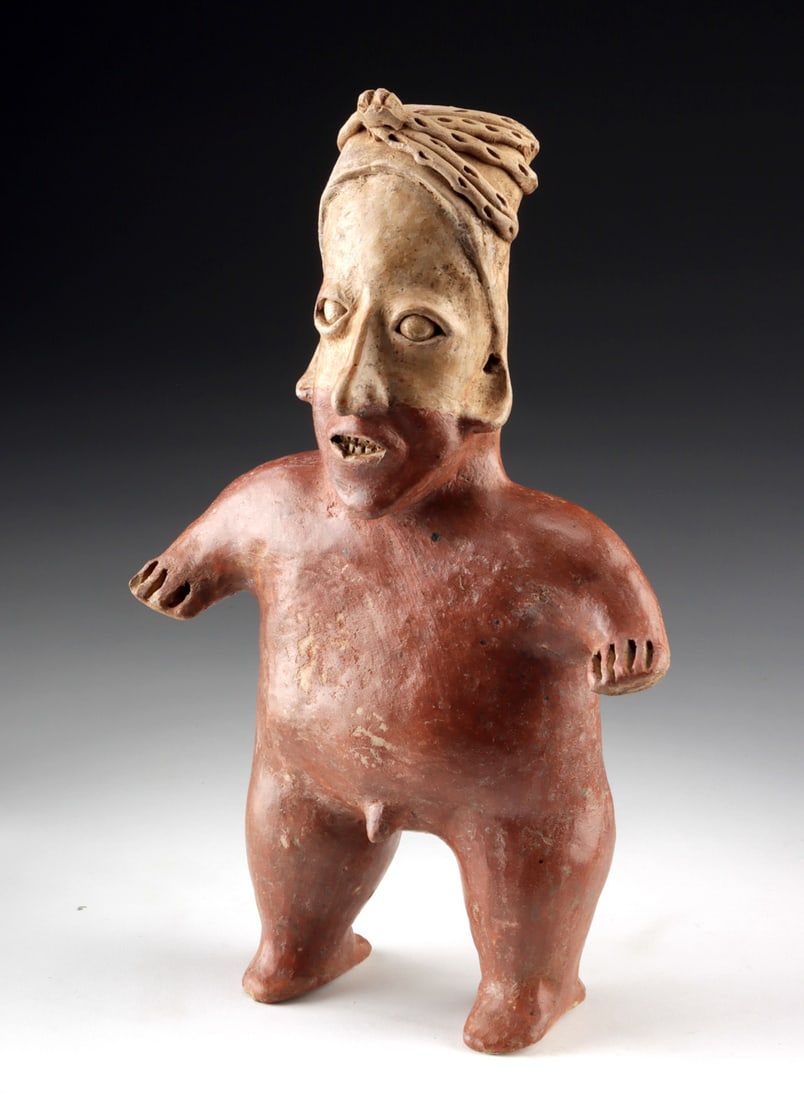 Jalisco Standing Male Figure w/ Modeled Phallus & Open Mouth: Pre-Columbian, West Mexico, Jalisco, ca. 300 BCE to 300 CE. A commanding Jalisco pottery figure presents a nude male standing with a directness that is both physical and symbolic, his compact body ren