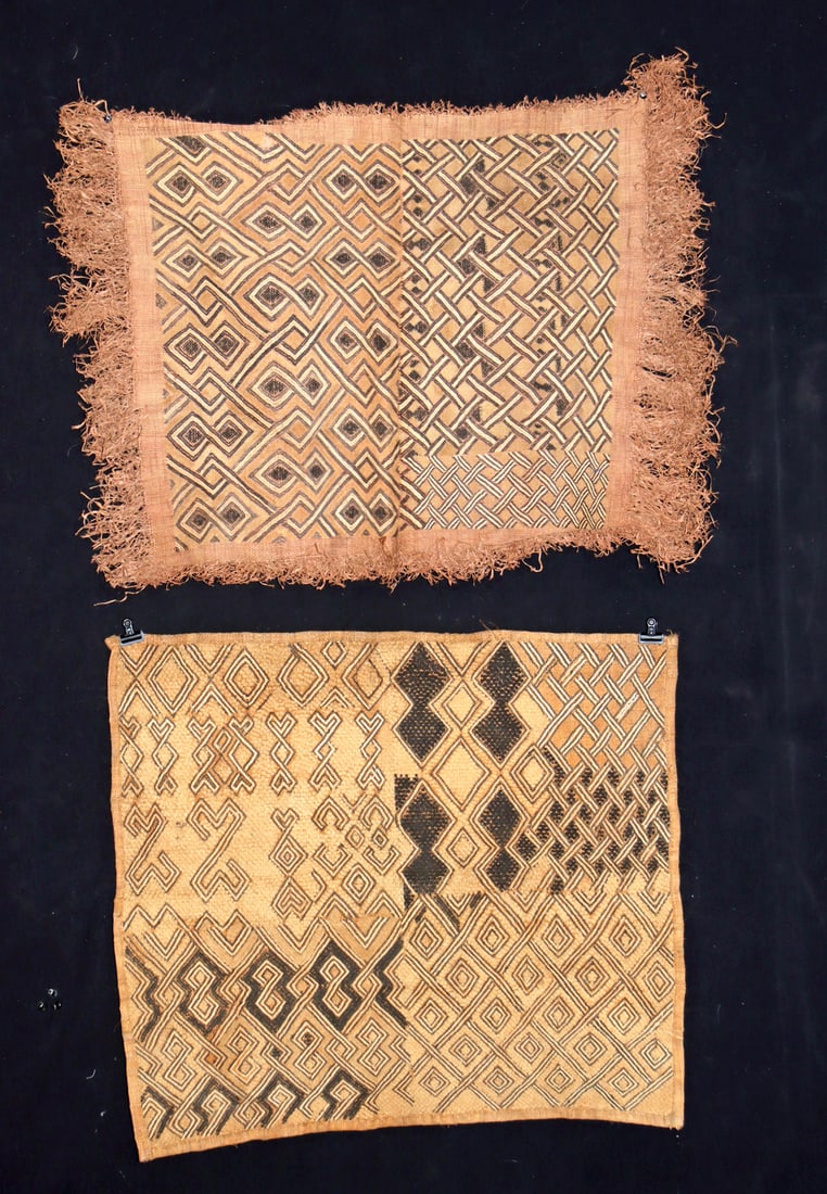 African Kuba Raffia Cloths w/ Cut-Pile & Embroidery: Central Africa, Democratic Republic of the Congo, Kuba, ca. mid-20th century CE. A pair of handwoven traditional textiles made from raffia palm fibers, one finished with tassels along the outer edge.