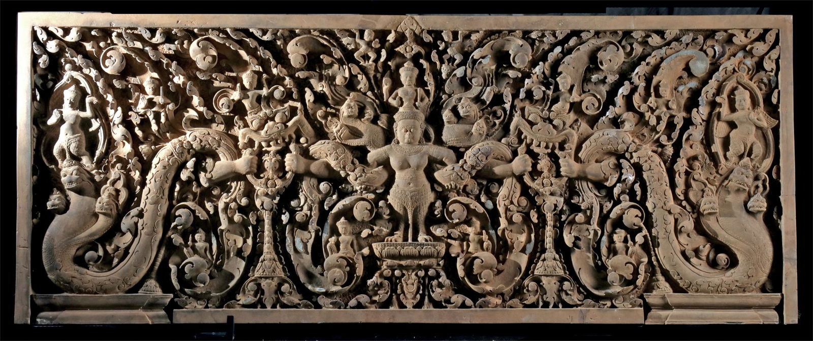 Large Cambodian Stone Lintel - Vishnu on Garuda: Southeast Asia, Cambodia, in the style of the Preah Ko period (late 9th century CE), ca. 20th century CE. A monumental stone relief lintel of extraordinary scale and craftsmanship, intricately carved