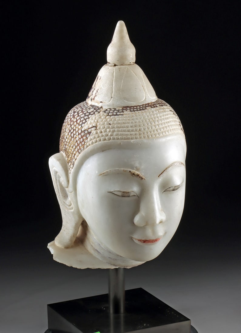 Large Burmese Sagyin Marble Head of Buddha, Mandalay Period: Southeast Asia, Burma, modern day Myanmar, Mandalay period, ca. late 19th to early 20th century. A lovely white marble Buddha head, slightly over life-sized and from a larger statue, carved with a sof