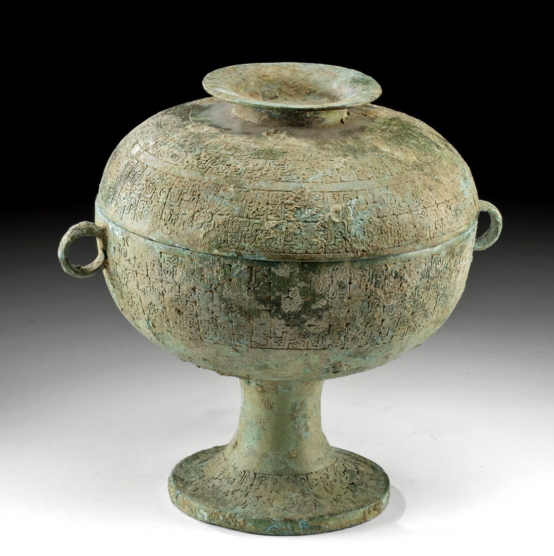 Chinese Warring States Bronze Dou - Lidded Food Vessel: East Asia, China, Warring States period, ca. 475 to 221 BCE. A finely cast bronze lidded and footed vessel, known as a dou, with an elegant domed cover, shallow bowl, and tall flaring foot. The form i