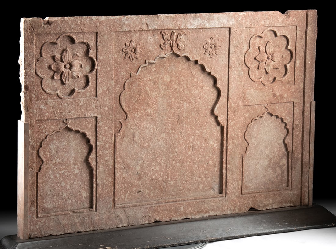 Indian Mughal 18th C. Sandstone Panel, ex-Sotheby's: South Asia, India, Northern region, ca. 18th century CE. A large carved architectural panel of mottled pink sandstone, rectangular in form and adorned with finely executed Mughal-style motifs. The rel