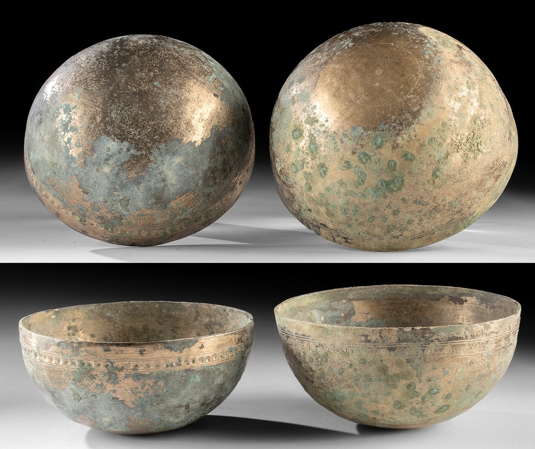 3rd Century Sassanian Persian High Tin Bronze Bowls: Near East / Central Asia, Persia, Sassanian Empire, ca. 3rd to 7th century CE. A pair of bronze bowls in a hemispherical shape, each animated by concentric circles etched across the exterior surfaces.