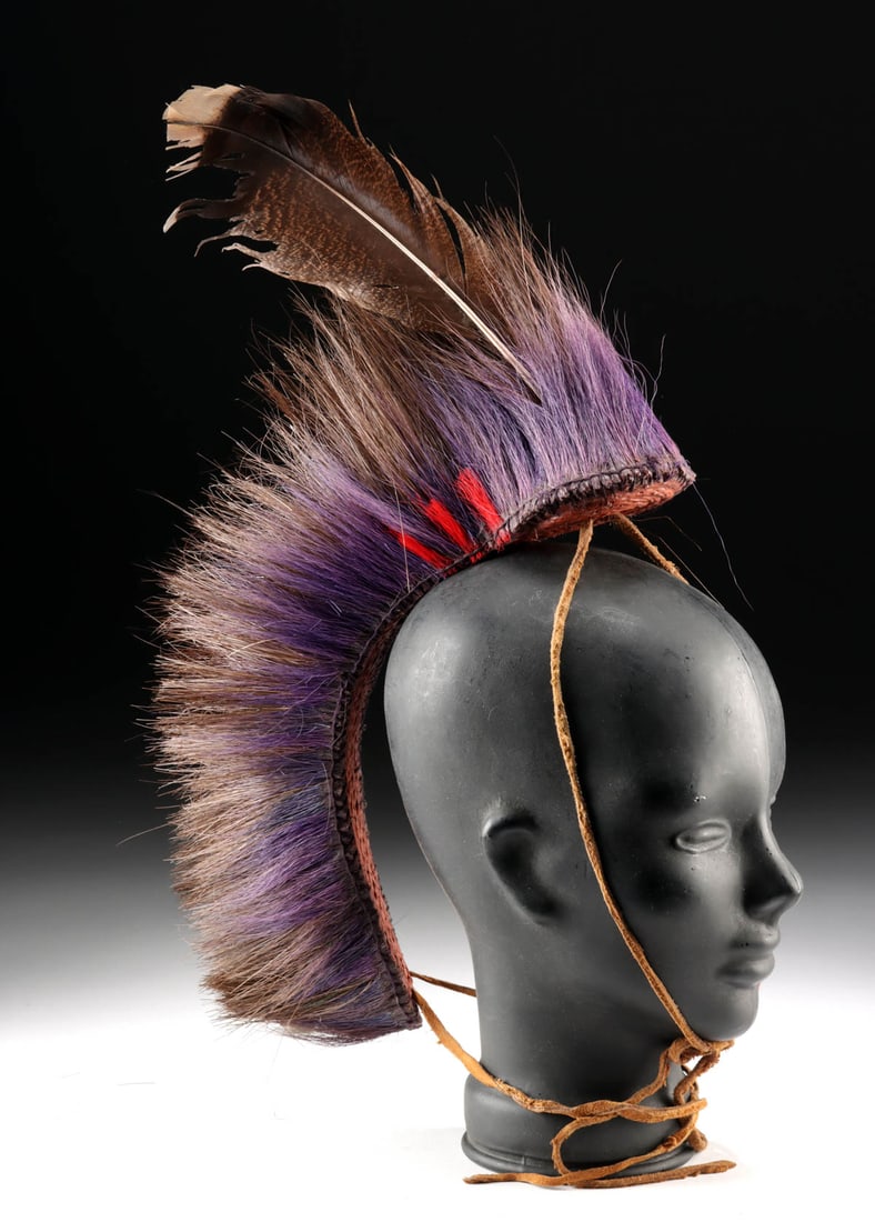 Western Plains Porcupine Roach Headdress, ex-Coe: Native American, Western United States, Plains region, ca. 20th century. A roach headdress composed primarily of porcupine guard hairs, accented with dyed horsehair and a large turkey feather. The cor