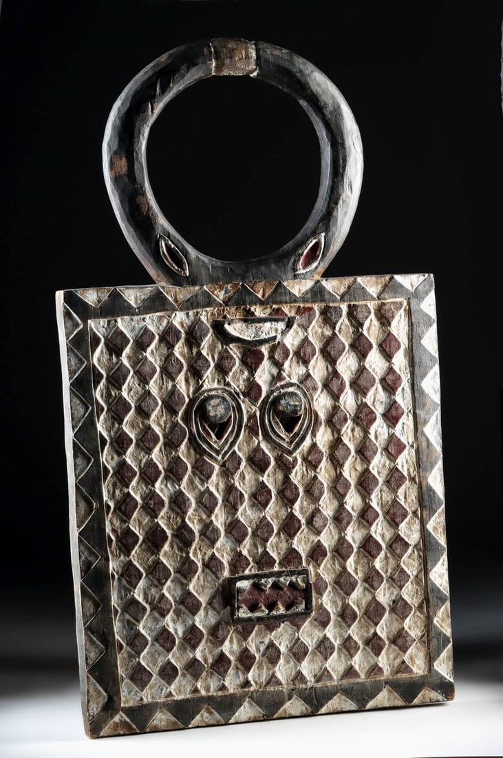 Baule Goli Kple Kple Wood Mask, Diamond-Pattern Panel & Horn Crest: West Africa, Ivory Coast (Cote d'Ivoire), Baule (Baoule) culture, ca. mid-20th century CE. A large variant of a Goli Kple Kple mask carved from a single piece of wood with red, black, and white pigmen