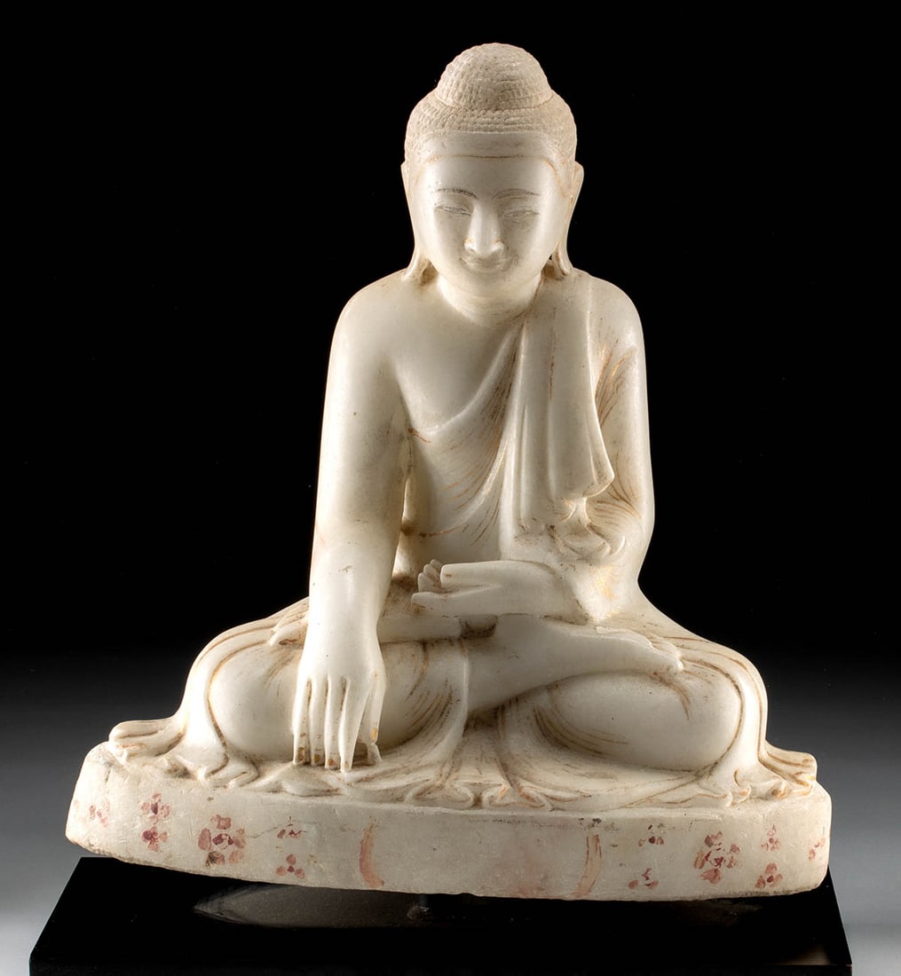 19th C. Burmese Mandalay Marble Seated Buddha Sculpture: Southeast Asia, Burma, 18th to 19th century CE. A marble seated Buddha in the Mandalay style, shown in full lotus posture with the right hand lowered to touch the earth in the bhumisparsha (earth-witn
