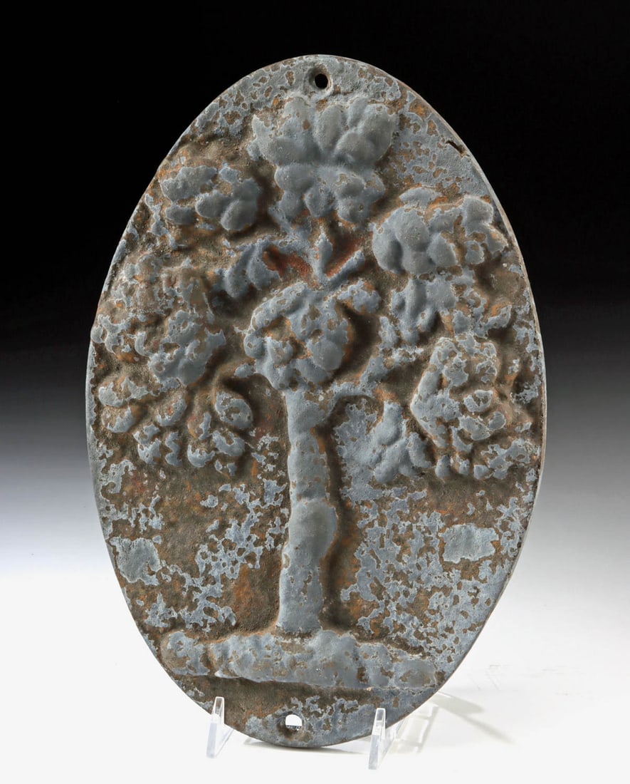 Early 1800s Cast Iron Mutual Fire Insurance Tree Plaque: United States, Pennsylvania, ca. 1808 to 1829 CE. A cast iron fire insurance marker featuring a raised tree motif associated with the Mutual Assurance Company, and fitted with pierced holes for mounti