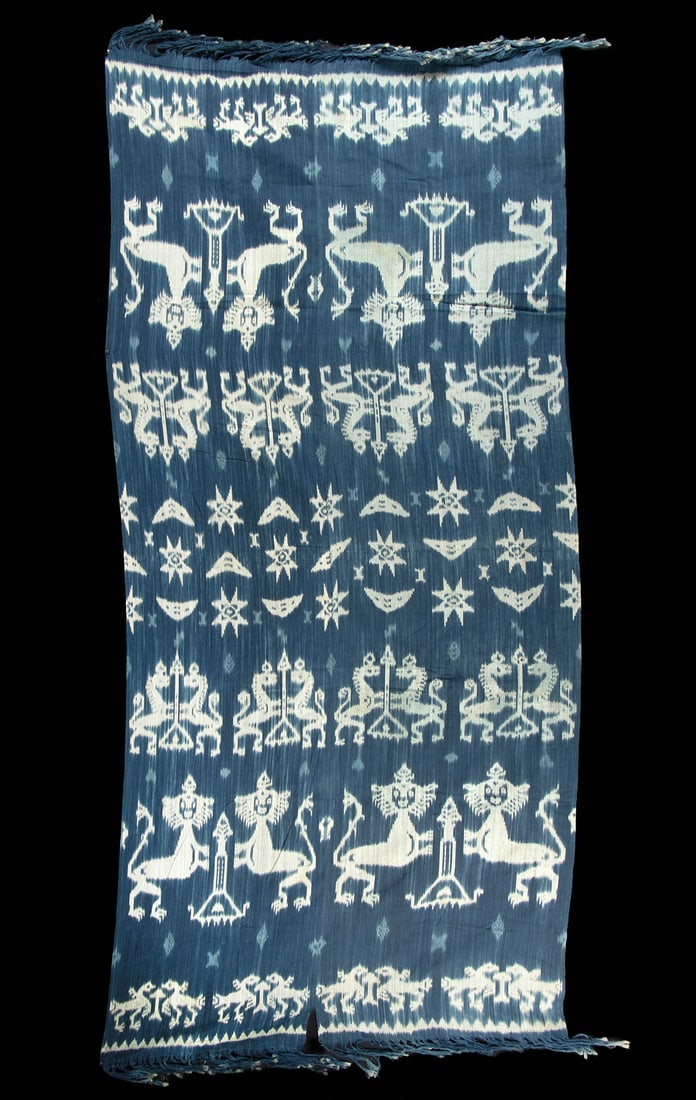 Indonesian Sumba Indigo Resist Dyed Ikat Textile Panel: Southeast Asia, Indonesia, Sumba Island, ca. late 19th to early 20th century CE. An indigo-dyed ikat hinggi textile composed of two woven cotton warp panels joined and neatly seamed together, decorate