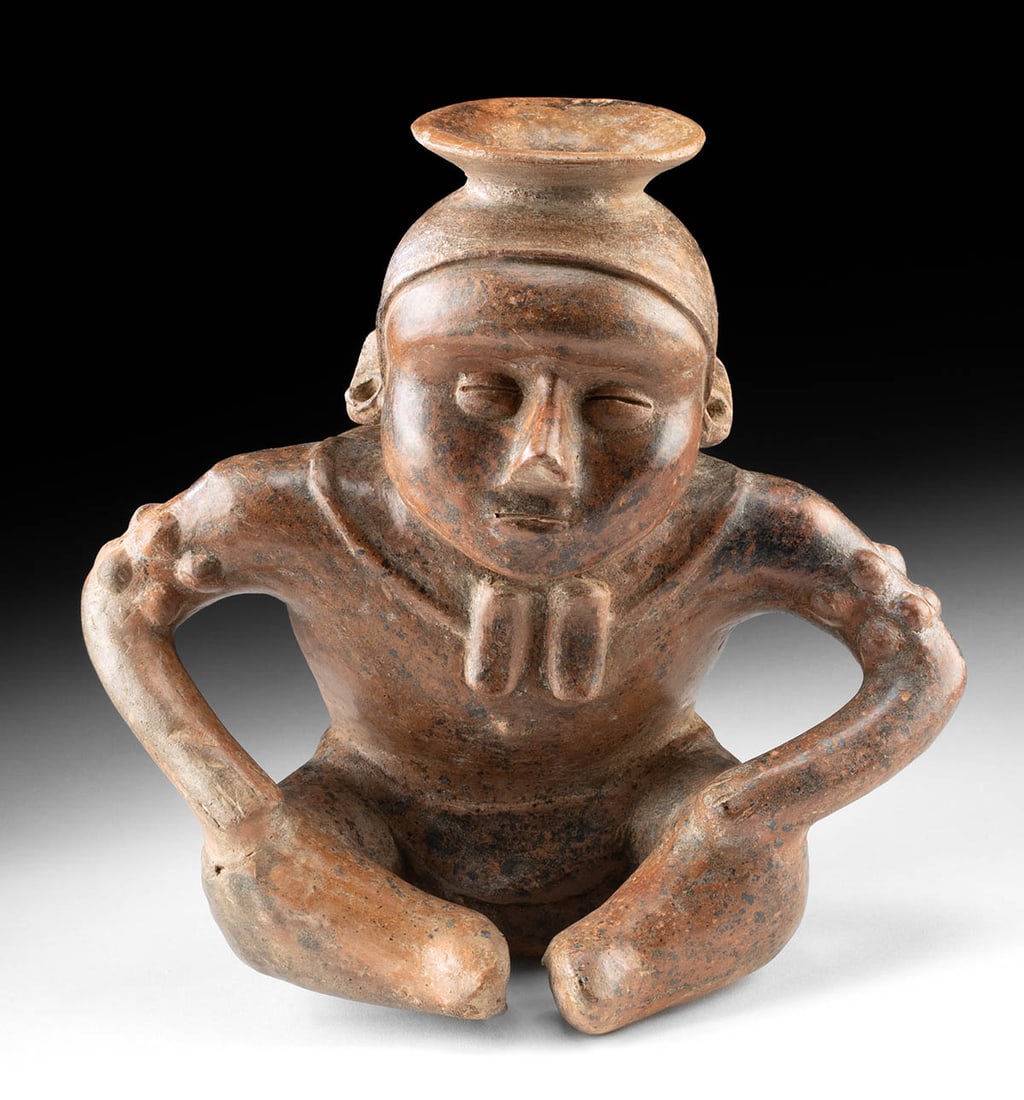 Colima Pottery Seated Hunchback Vessel w/ Stippled Arms: Pre-Columbian, West Mexico, Colima, ca. 300 BCE to 300 CE. A Colima hunchback sits in quiet concentration, his compact body folded into the archetypal pose of this deeply symbolic West Mexican genre.