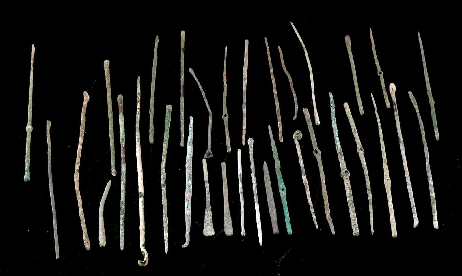 Classical Roman Bronze Pins & Specillum Probes, 33pcs: Greek & Roman Empires, ca. 1st millennium BCE to early centuries CE. A collection of 33 long, narrow pin-shaped artifacts, all cast from bronze and copper alloys, likely originating from Roman and nei