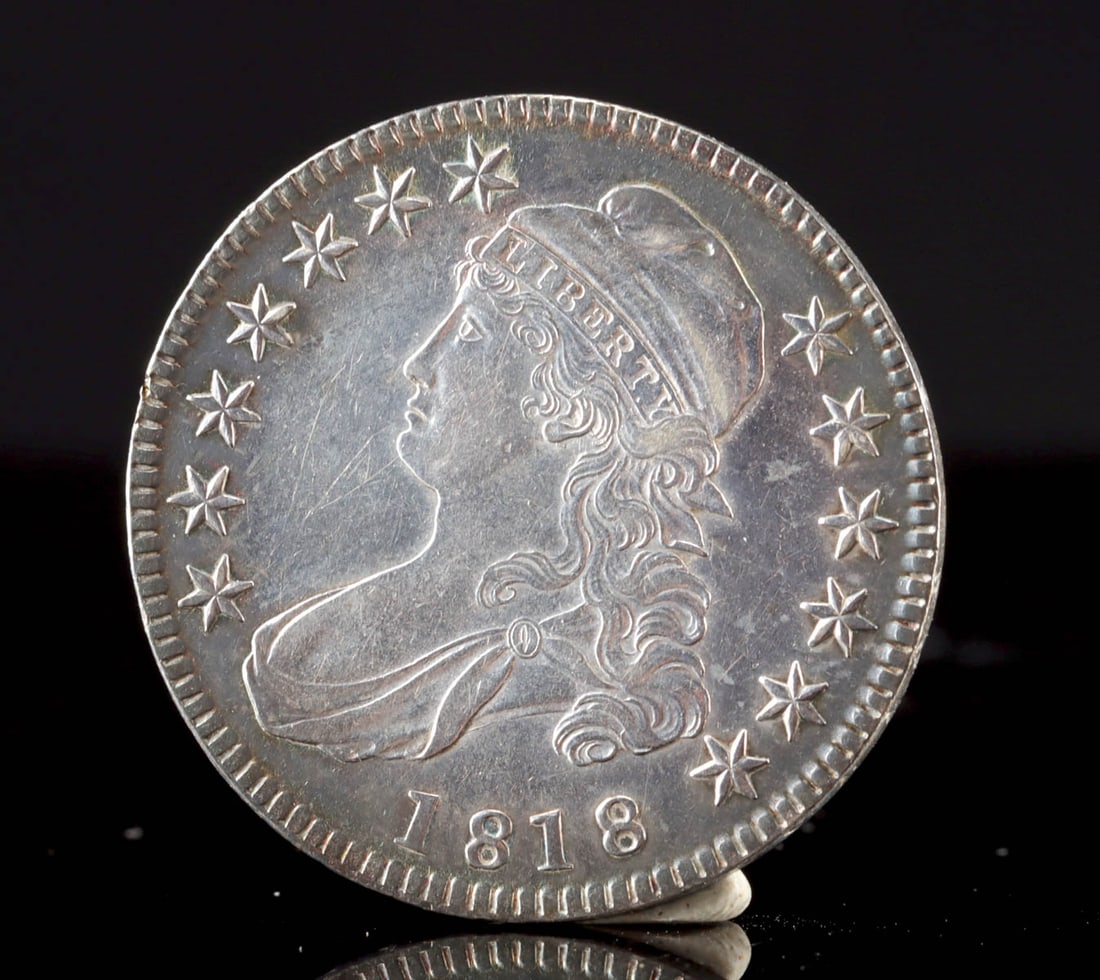 1818 USA Capped Bust Half Dollar Silver Coin, XF!: United States, ca. 1818 CE. A capped bust half dollar of the Lettered Edge type, showing a left-facing profile of Liberty wearing a cap inscribed LIBERTY on the obverse, and a heraldic eagle on the re