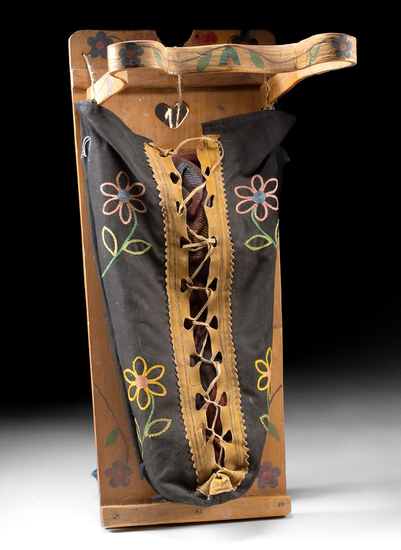 Ojibwe Painted Cedar Cradleboard + Embroidered Moss Bag: First Nations / Native American, Eastern Canada / United States, Great Lakes region, Anishinaabe culture, Chippewa / Ojibwe, ca. early to mid 20th century CE. A fine cedar wood cradleboard with double