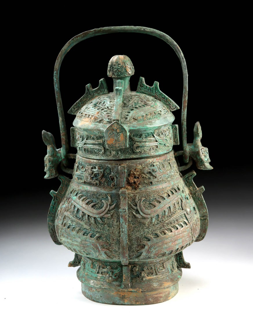 19th C. Qing Archaistic Leaded Brass You Vessel: East Asia, China, Qing Dynasty, ca. 19th century; in the archaistic style of the Shang period. A deliberate invocation of antiquity, this handled ritual vessel reflects the Qing dynasty fascination wi
