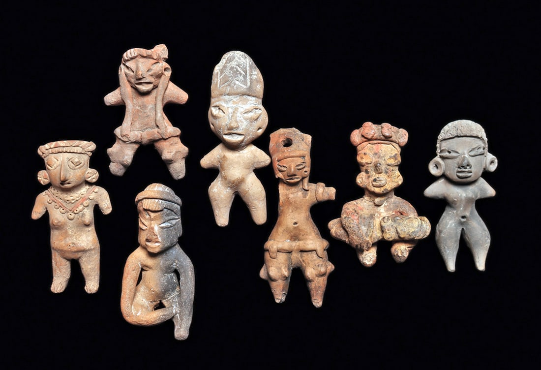 Pre-Classic Solid Pottery Figures (7): Group of seven different solid pottery figures, including a Tlatilco seated figure holding a child across her lap, with some remaining ocher and red painted highlights. Intact, a nice example. A seate