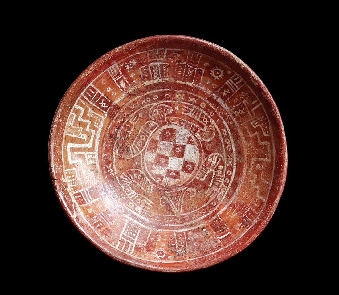 Nayarit Pedestal Bowl: Pottery pedestal bowl having a white painted decoration depicting a turtle in the center, and surrounded by geometric and sun elements, on a two tone red and orange ground strong Mixtect influence. Re