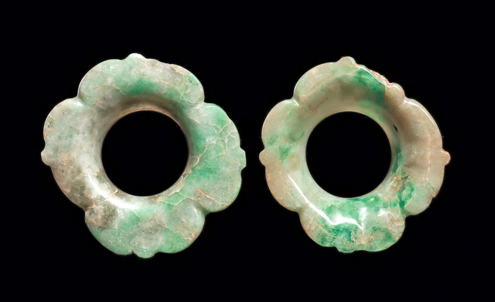 Fine Maya Jade Earspools (2): Fine matching pair of floral design ear ornaments of variegated brilliant blue-green and creamy green jade, each having four large petals terminating with a central point, integral spool insert. One h