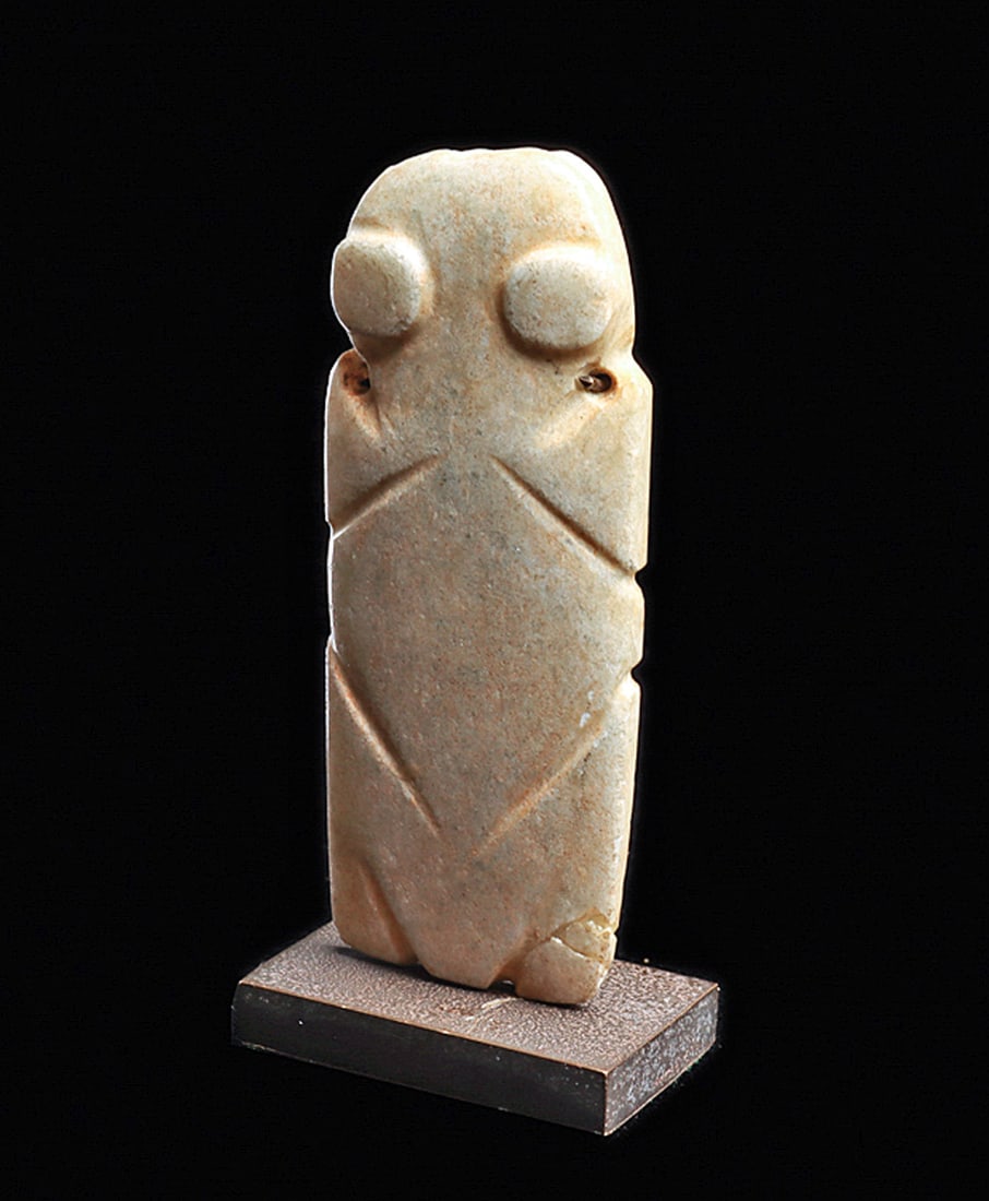 Costa Rican Jade Cicada Pendant: Carved creamy grayish-white jade stylized cicada insect pendant, depicted with large disc eyes and diagonal linear details. Two tiny biconical drilled suspension holes in his neck. Intact, exc. cond.