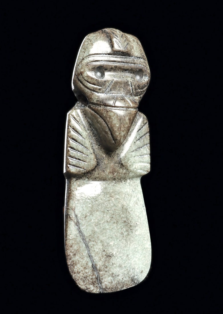 Costa Rican Axe God Condor Pendant: Carved variegated grayish-green jade avian god celt pendant. Boldly carved in high relief, head with a large curved pointed beak, face mask type borders surrounding his eyes, and raised center head cr