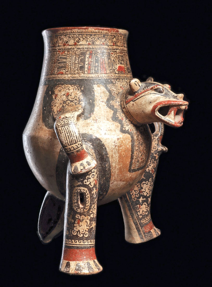 Costa Rican Jaguar Urn: Large polychrome decorated pottery urn, depicting a jaguar having a large projecting head with an open toothy mouth with a rattle ball in his head and legs. Perked ears, large loop type arms with his
