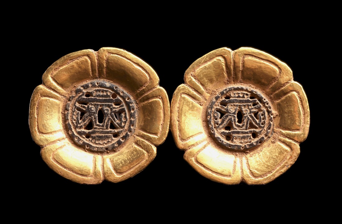 Aztec Gold Over Pottery Floral Ear Ornaments (2): Fine matching pair of blackware ceramic ear ornaments of floral design and having a openwork center roundel depicting two perched birds. The petals are covered with a beautifully applied ancient gold