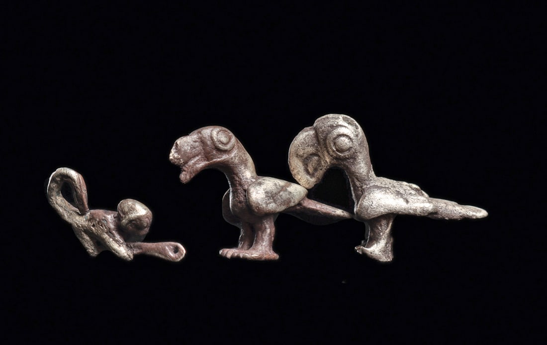 Inca Silver Parrot & Monkey Pendants (3): Three solid silver necklace pendants, including two similar parrots having large curved beaks, and a suspension hole through their heads. Excellent ancient surface patinas. Some surface weathering, ot