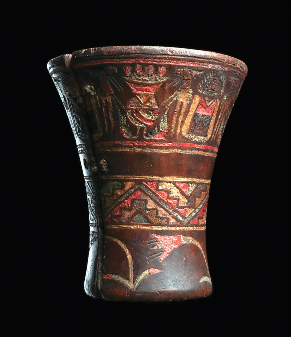 Inca Wooden Decorated Kero: Carved wooden kero, decorated with a wide upper band having three stylized human figures (originally four, but one now missing). Each figure is flanked by two large food vessels with birds. Lower wide