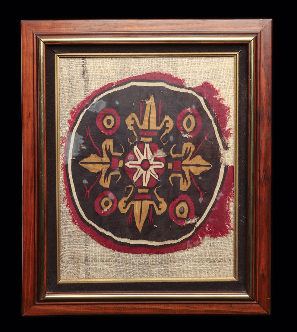 Colonial Peruvian Framed Textile Roundel: Large roundel, tight and finely woven multicolor example with four large concentric circular elements surrounding a large four prong shield with a central floral element. Originally, probably the cent