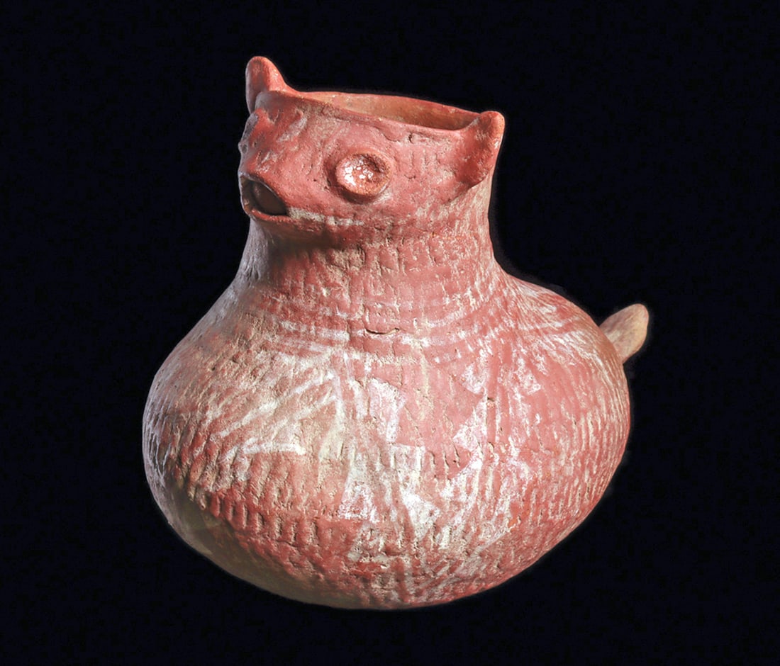 McDonalds Corrugated Bobcat Effigy Pottery Vessel: Salmon color pottery corrugated ware pottery figural vessel depicting a stylized bobcat with perked ears and raised tail. Overall painted chalk-white stepped and linear decoration. Intact, exc. cond.