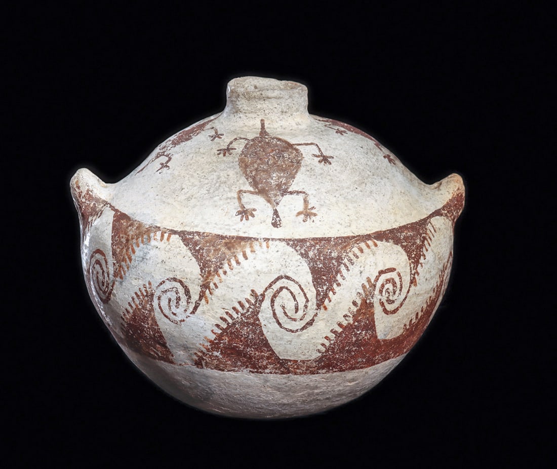 Anasazi / Red Meza Lizard Decorated Vessel: Red-brown on white painted pottery canteen vessel, having opposing perforated lug handles. Upper portion is decorated with four stylized lizards. The body has a painted wide wave band. Some normal gen