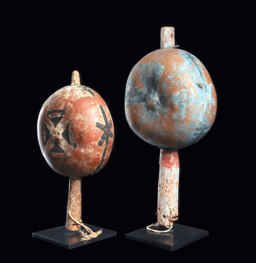 Hopi Ceremonial Dance Rattles (2): Two ceremonial gourd dance rattles, both have stylized cross elements, which represent the rain clouds of the four cardinal directions radiating from a universal center. The larger example has general