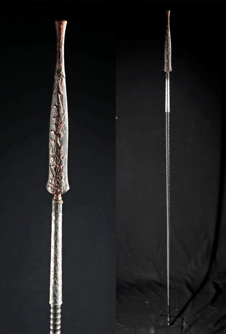 Superb & Rare Javanese Royal Guard Tombak Spear: Southeast Asia, Indonesia, Java, ca. 19th century or earlier CE. A tall and striking tombak spear, featuring a long wooden shaft carved with a continuous grooved texture for both grip and decoration.