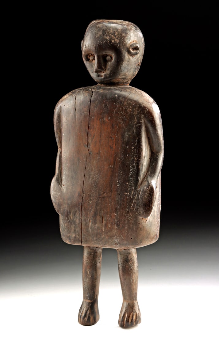 Indonesian Sumba Kabiru Cotton Board, Human Form: Southeast Asia, Indonesia, Sumba Island, ca. 19th to early 20th century CE. A sculptural cotton board known as a kabiru, carved from a single plank of dark, dense wood and shaped as a simplified