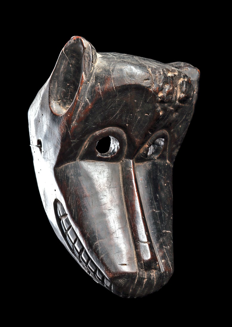 Himalayan Monkey Mask: Excellent old mask of a monkey from Hanuman's army, worn in the Ramayana epic, carved of heavy hardwood with concave ears, large circular eye openings and angular snout and engraved teeth. Weathered l