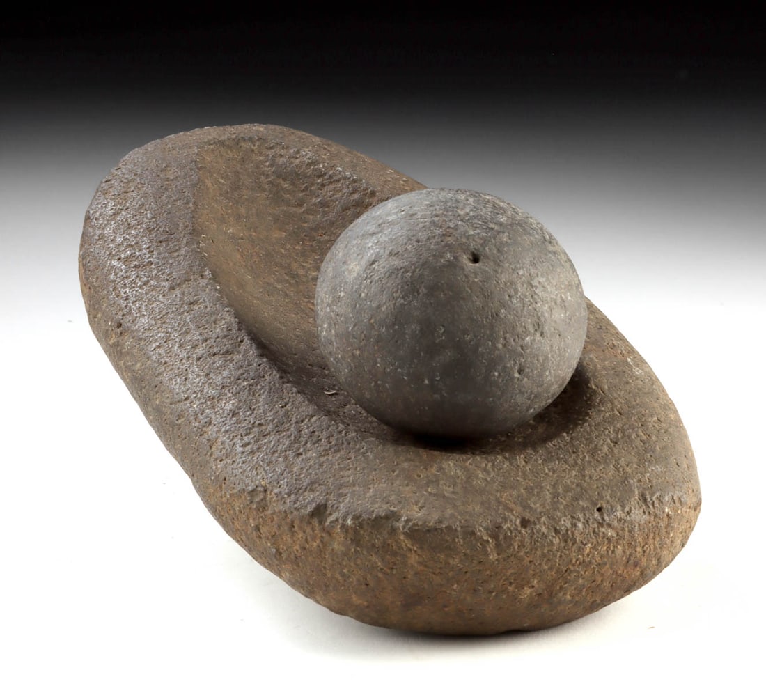 Mississippian Caddo Stone Mortar and Pestle: Native American, Southeastern United States, Mississippian culture, Caddo peoples, ca. 900 to 1600 CE. A powerful and tactile Mississippian period stone mortar and pestle attributed to the Caddo peopl