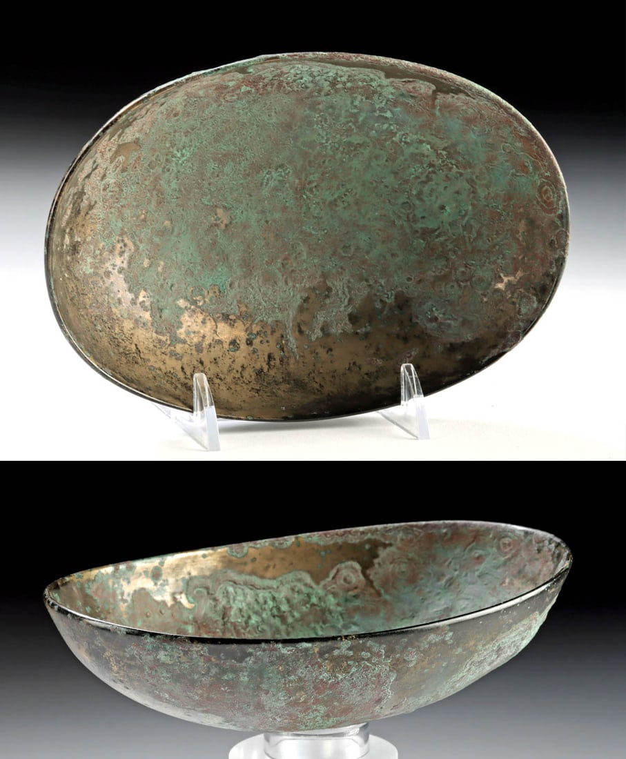 Persian Bronze bowl - Sasanian: Iran/Persia, Sasanian period, bronze dish, ca. 3rd?7th century CE. A shallow bronze dish of gently oval form with a smooth, slightly incurved rim and rounded walls, the interior and exterior showing a