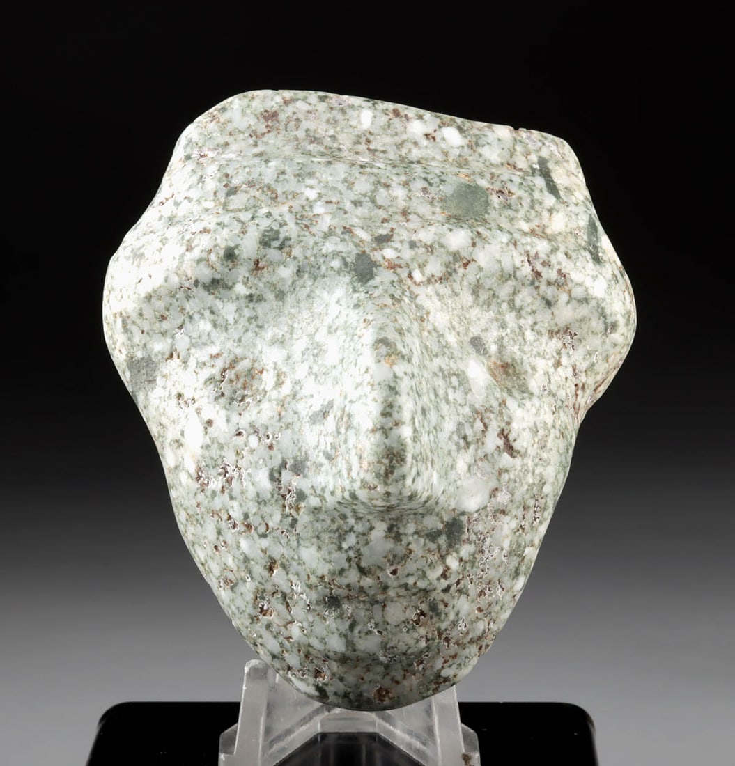 Mezcala Guerrero Greenstone Maskette Pendant: Pre-Columbian, Southern Mexico, Guerrero region, Mezcala culture, ca. 500 to 200 BCE. This stone head maskette is rendered in a simplistic yet naturalistic manner, with facial features reduced to shal